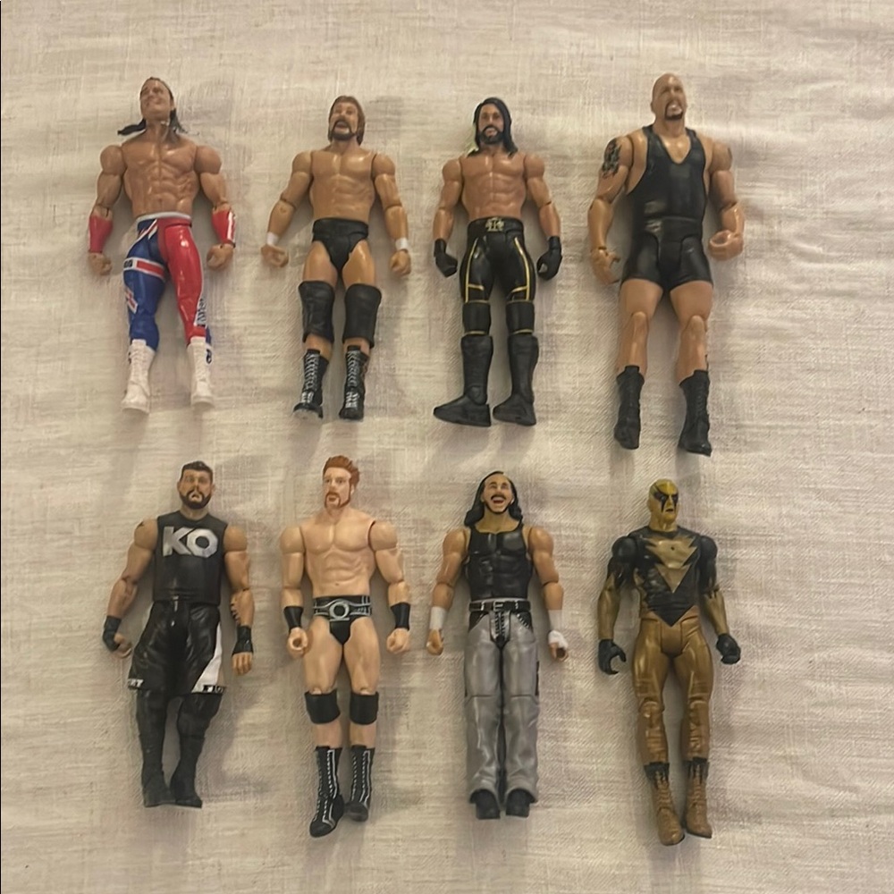 Lot of 8 WWE wrestling figures EUC